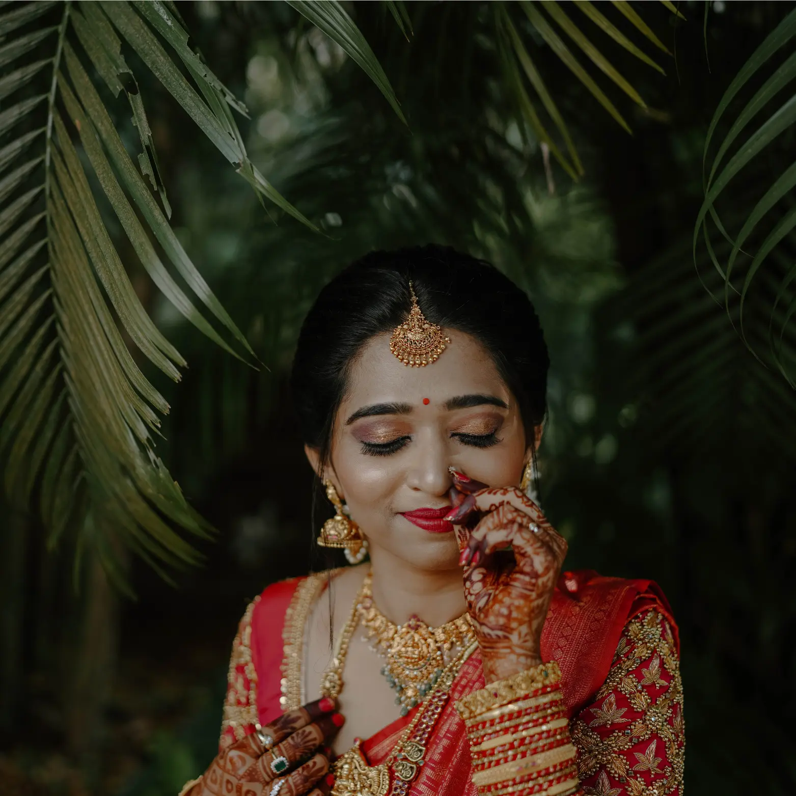 Joyful Haldi ritual with golden turmeric hues, capturing a bride’s authentic laughter as family members apply paste in a sunlit courtyard.